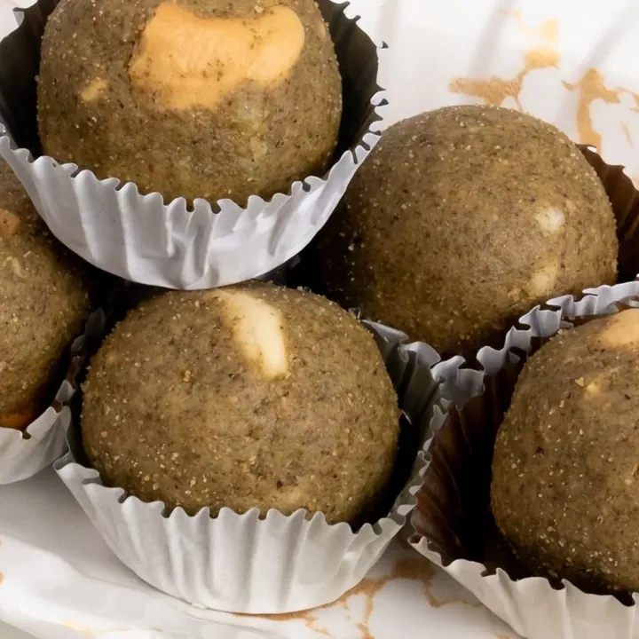 Moong ladoos arranged on a serving plate