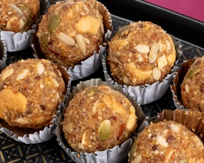 Dink dry fruit ladoos arranged on a serving plate