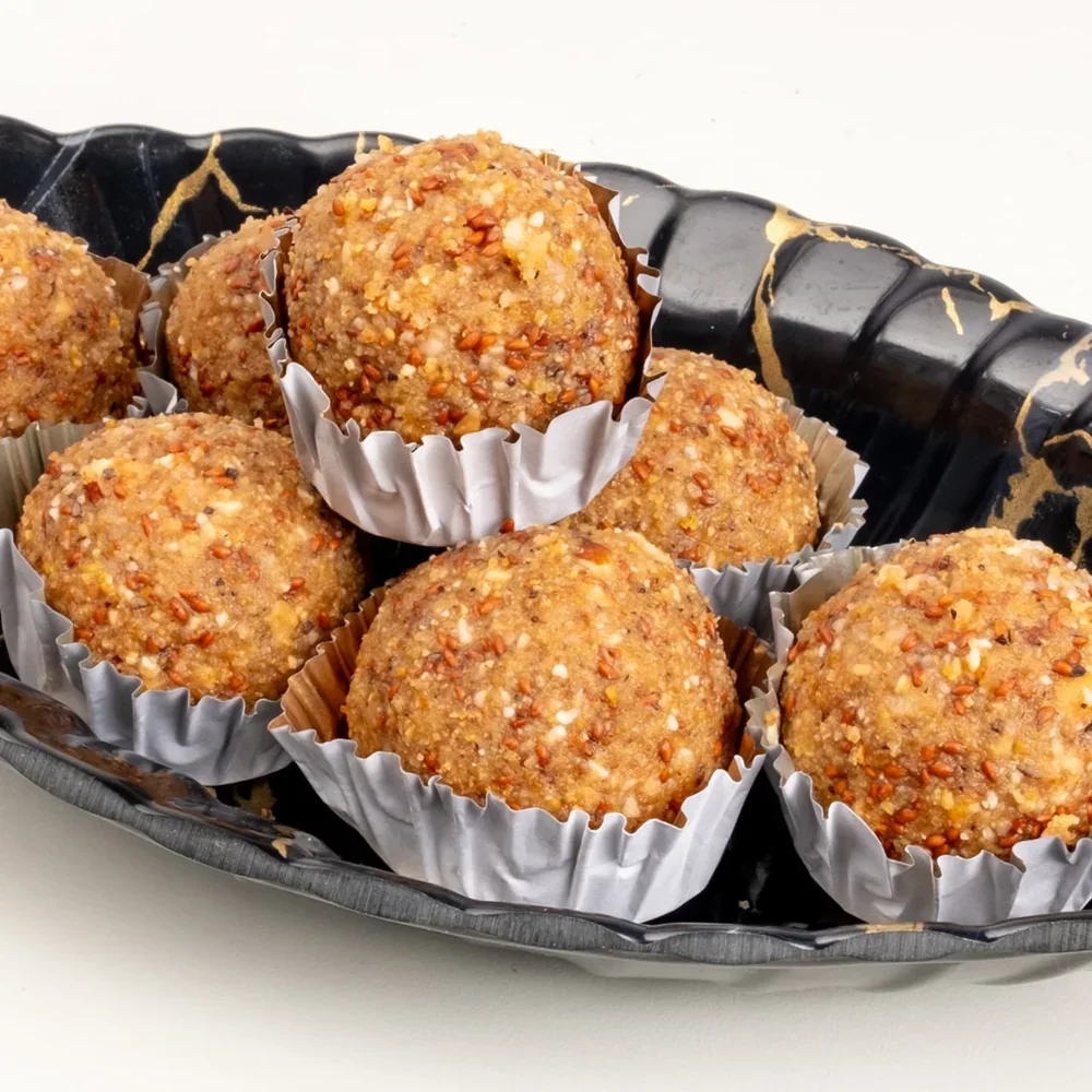 Aliv ladoos arranged on a serving plate